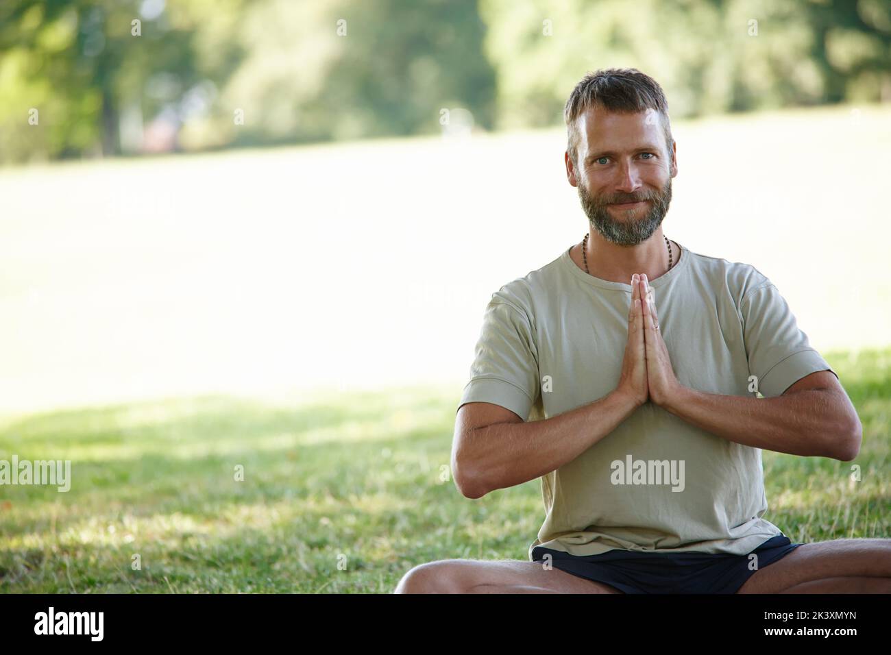 Yoga works for me. Cropped portrait of a handsome mature man doing yoga outdoors. Stock Photo