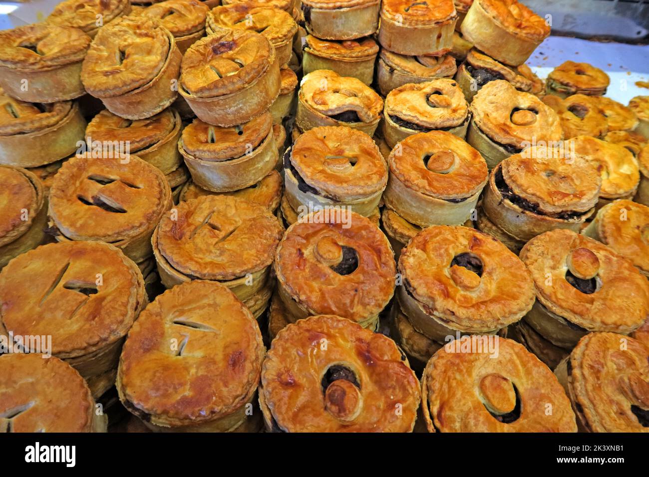 Pies at a bakers shop, piled up for retail purchase, Callandar, Scotland, UK, FK17 8AA Stock Photo