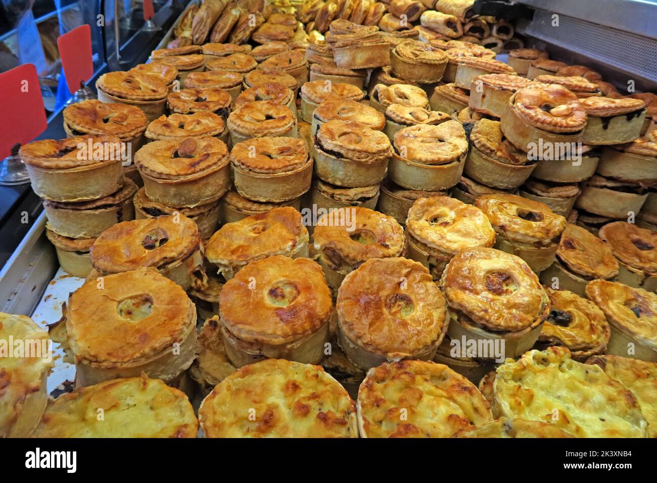 Pies at a bakers shop, piled up for retail purchase, Callandar, Scotland, UK, FK17 8AA Stock Photo