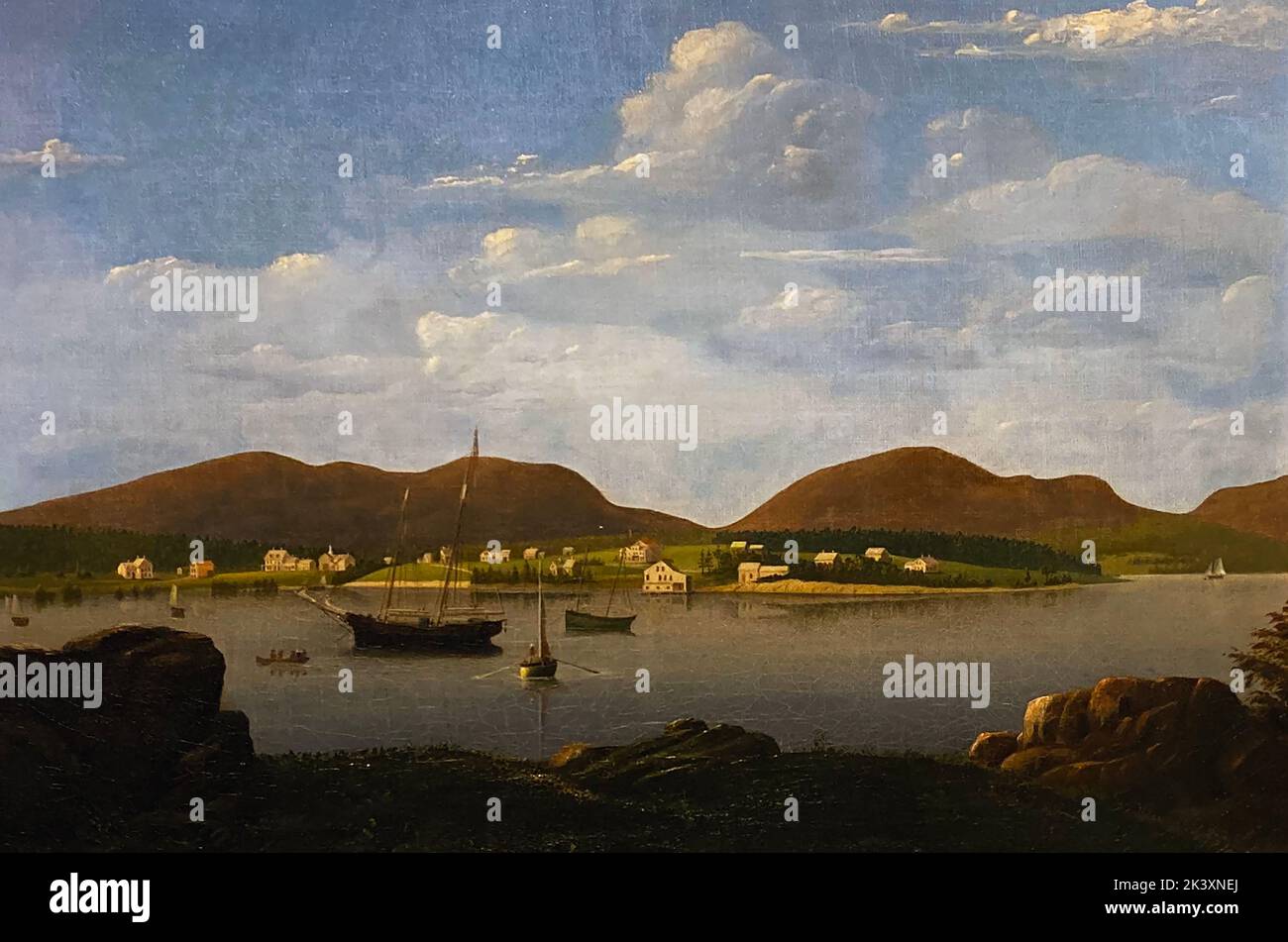 This painting by Fitz Henry Lane was done around 1850. The notes at the Farnsworth Museum in Rockland note 'Mary Mellen served as the artist’s apprentice, copying his works as exercises, and eventually working with Lane on canvases based on earlier paintings, including this view of the town on Mount Dessert, which Lane visited with his friend, Joseph Stevens, Jr.' Fitz Henry Lane (1804 – 1865) was an American painter and printmaker of a style that would later be called Luminism. Stock Photo