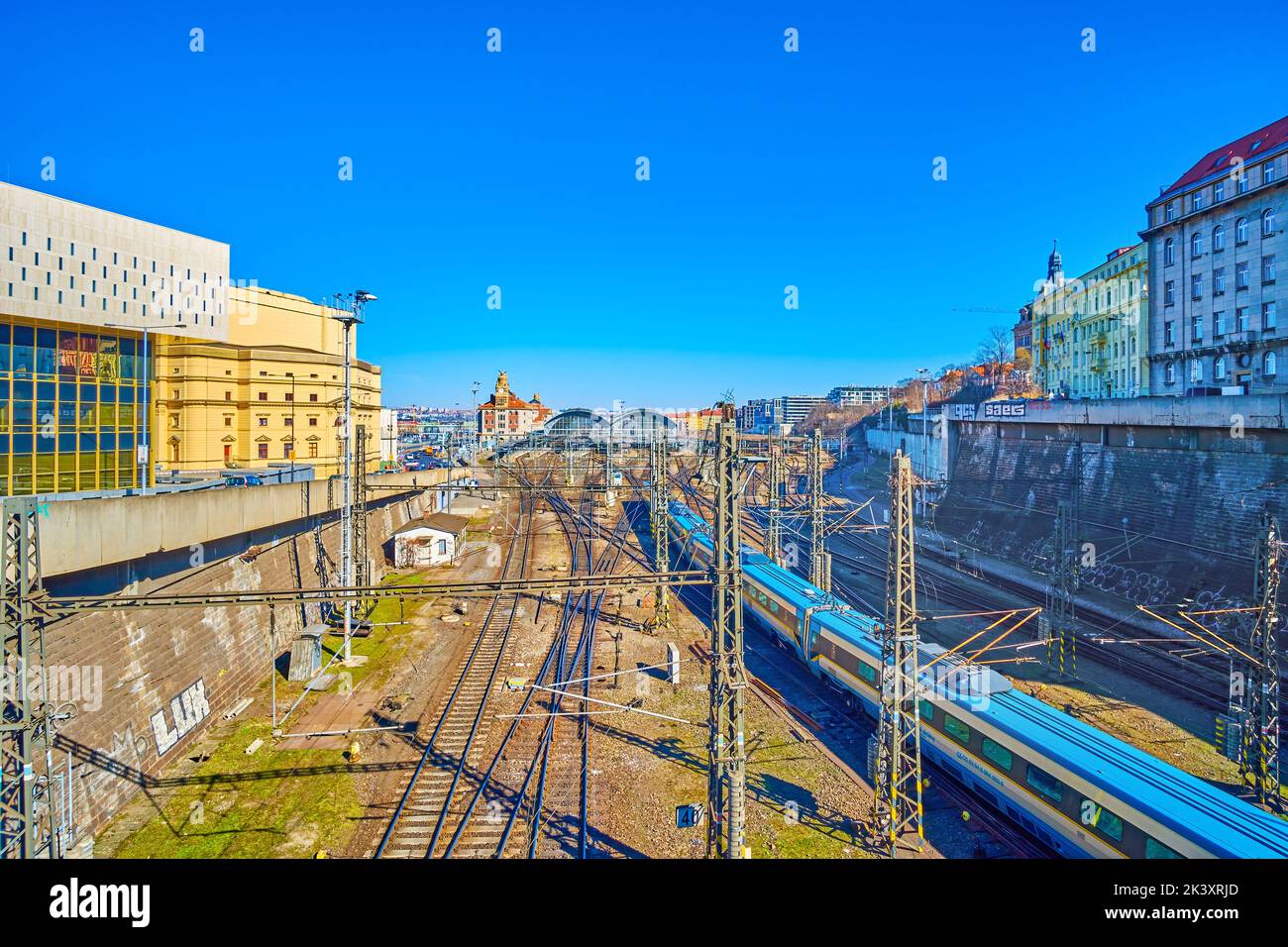 The view on railroad tracks and arriving train to main Railway Station in Prague, Czech Republic Stock Photo