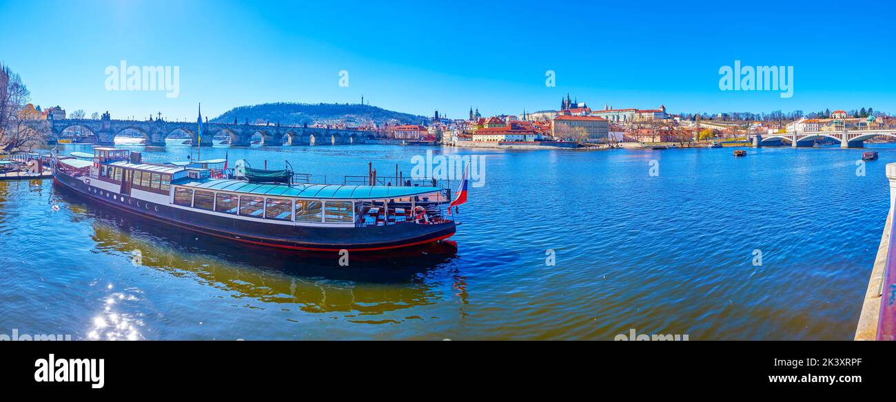 Panorama of Vltava river large tourist ship moored in the pier and Mala Strana district on background, Prague, Czech Republic Stock Photo