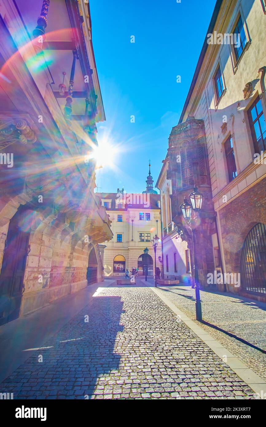 The bright morning sunbeam shines between medieval buildings in Stare Mesto district of Prague, Czech Republic Stock Photo