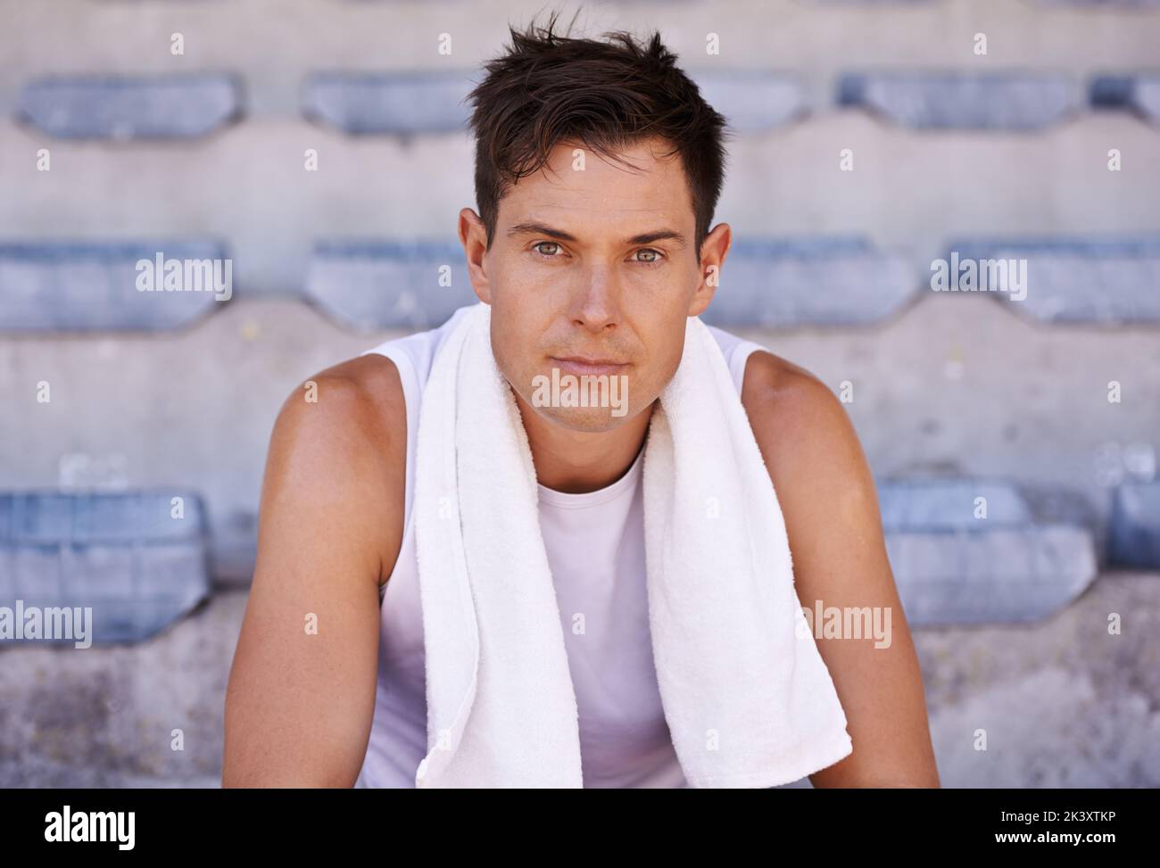 The exhaustion is worth it. Portrait of an athlete taking a break from training. Stock Photo