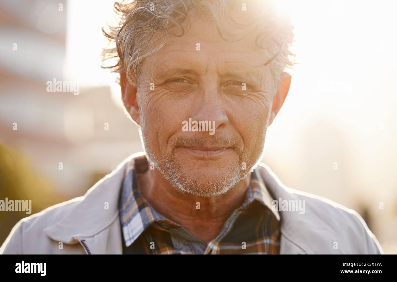 I live my life proudly. Portrait of a friendly-looking middle aged man outside. Stock Photo