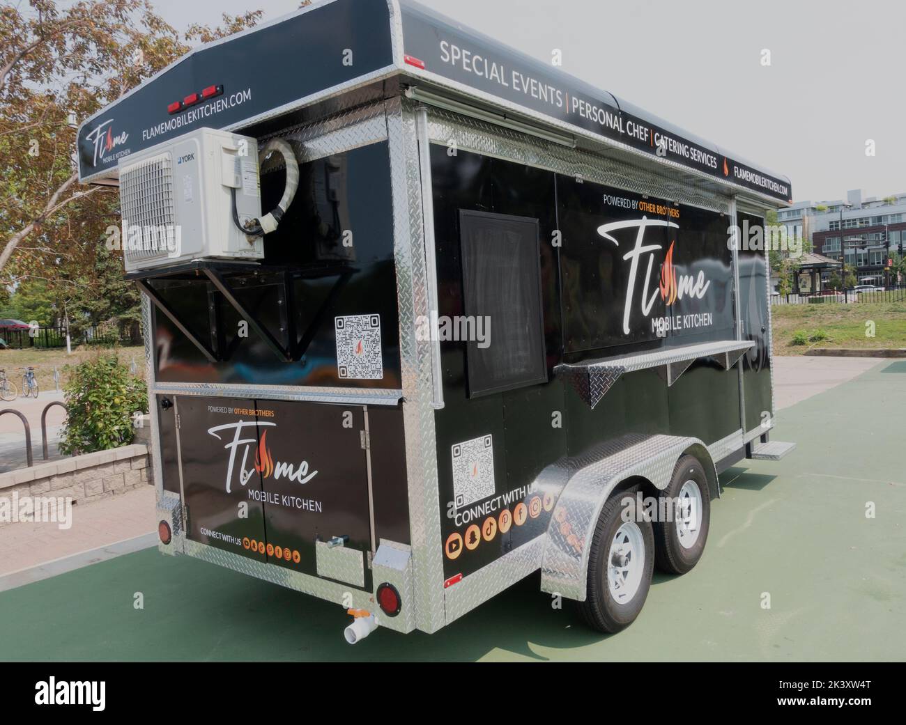 Black food trailer offering catering service hires stock photography