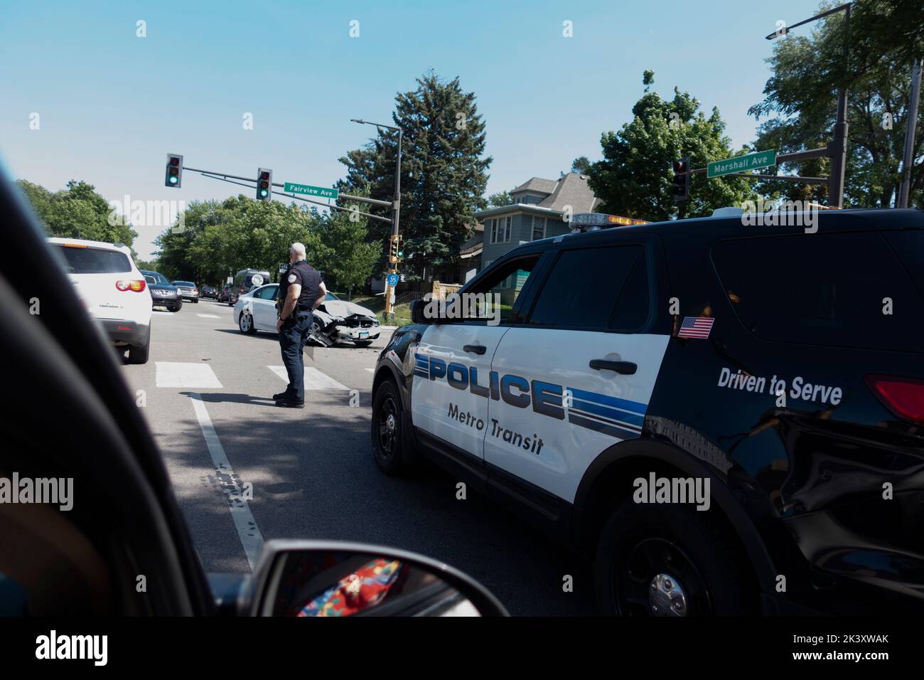Policeman present at a car accident directing traffic. St Paul Minnesota MN USA Stock Photo