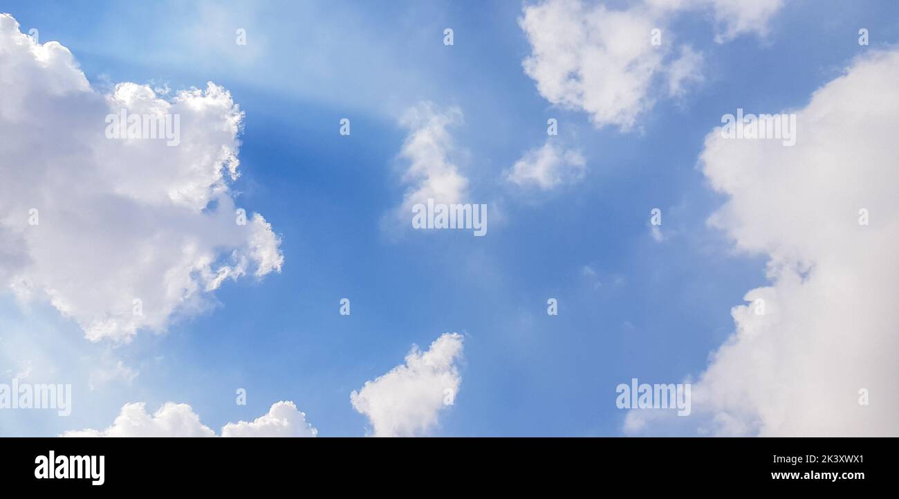 Puffy clouds in the blue sky Stock Photo
