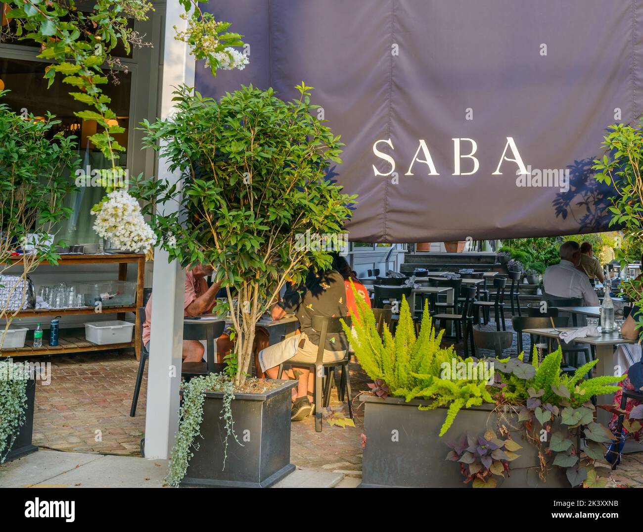 NEW ORLEANS, LA, USA - SEPTEMBER 25, 2022: Shaded outdoor dining area for Saba Restaurant on Magazine Street in Uptown New Orleans Stock Photo