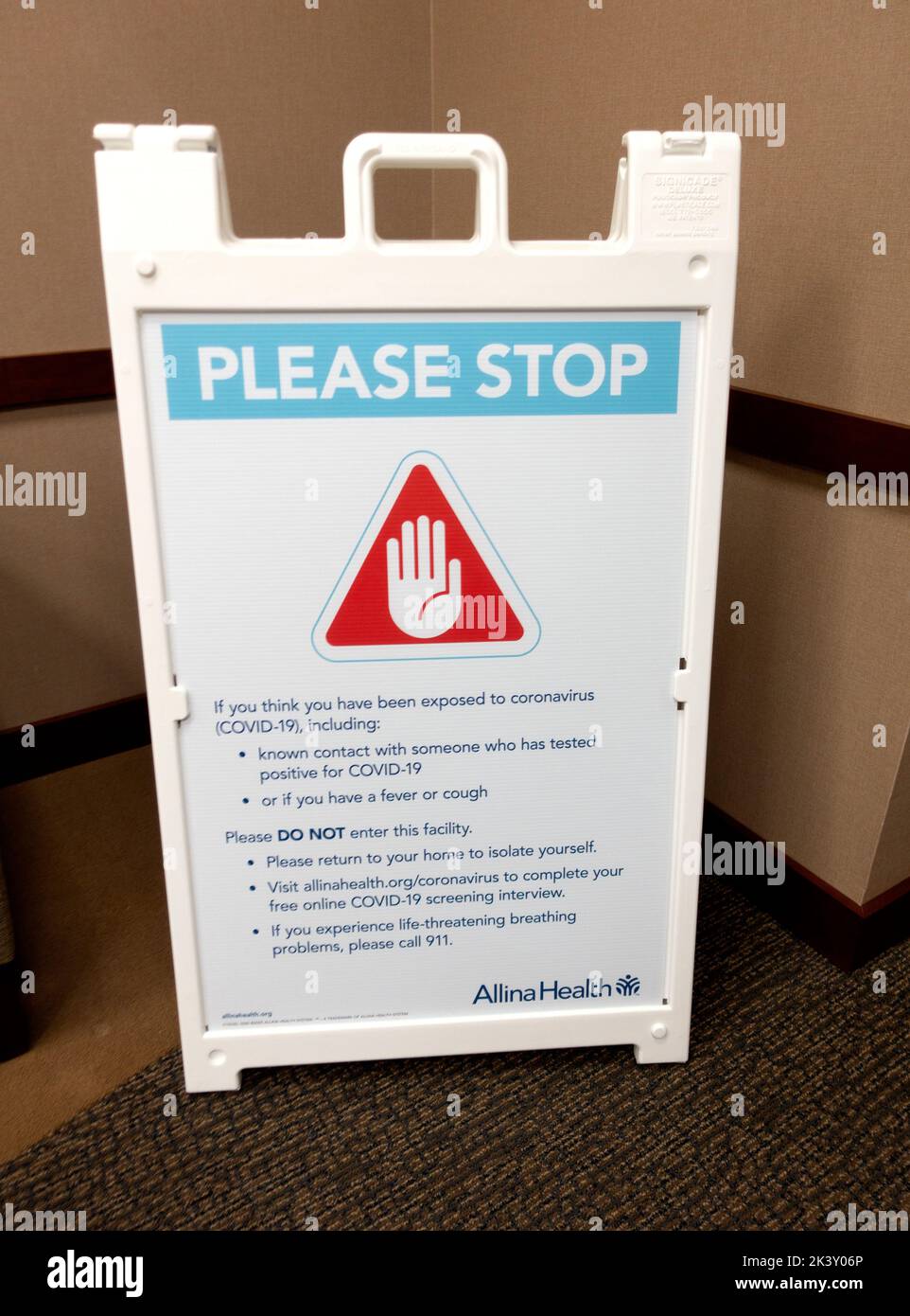 Floor a-frame warning sign asking individuals to not enter if they have been exposed to coronavirus COVID-19. St Paul Minnesota MN USA Stock Photo