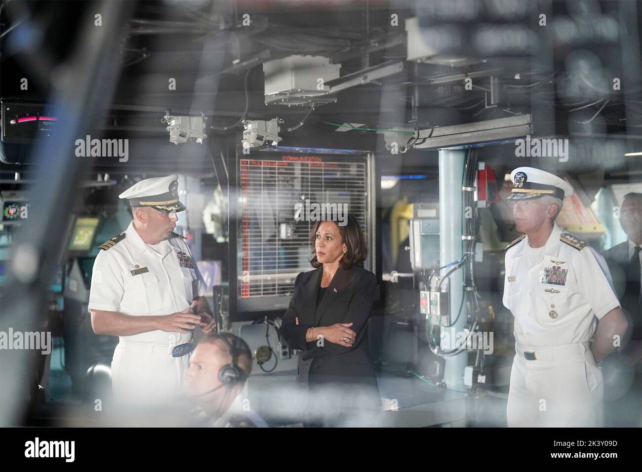 Yokosuka, Japan. 28th Sep, 2022. U.S Navy Cmdr. Travis Montplaisir, left, commanding officer of Arleigh Burke-class guided-missile destroyer USS Howard gives Vice President Kamala Harris and Vice Adm. Karl Thomas, right, commander, U.S. 7th Fleet, a tour of the combat information center aboard during a visit to Fleet Activities Yokosuka, September 28, 2022 in Yokosuka, Japan. Credit: Lawrence Jackson/White House Photo/Alamy Live News Stock Photo