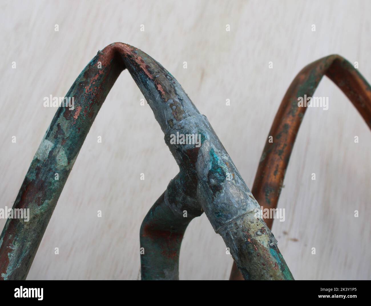 A Bent Piece of Old Copper Water Pipe Stock Photo Alamy