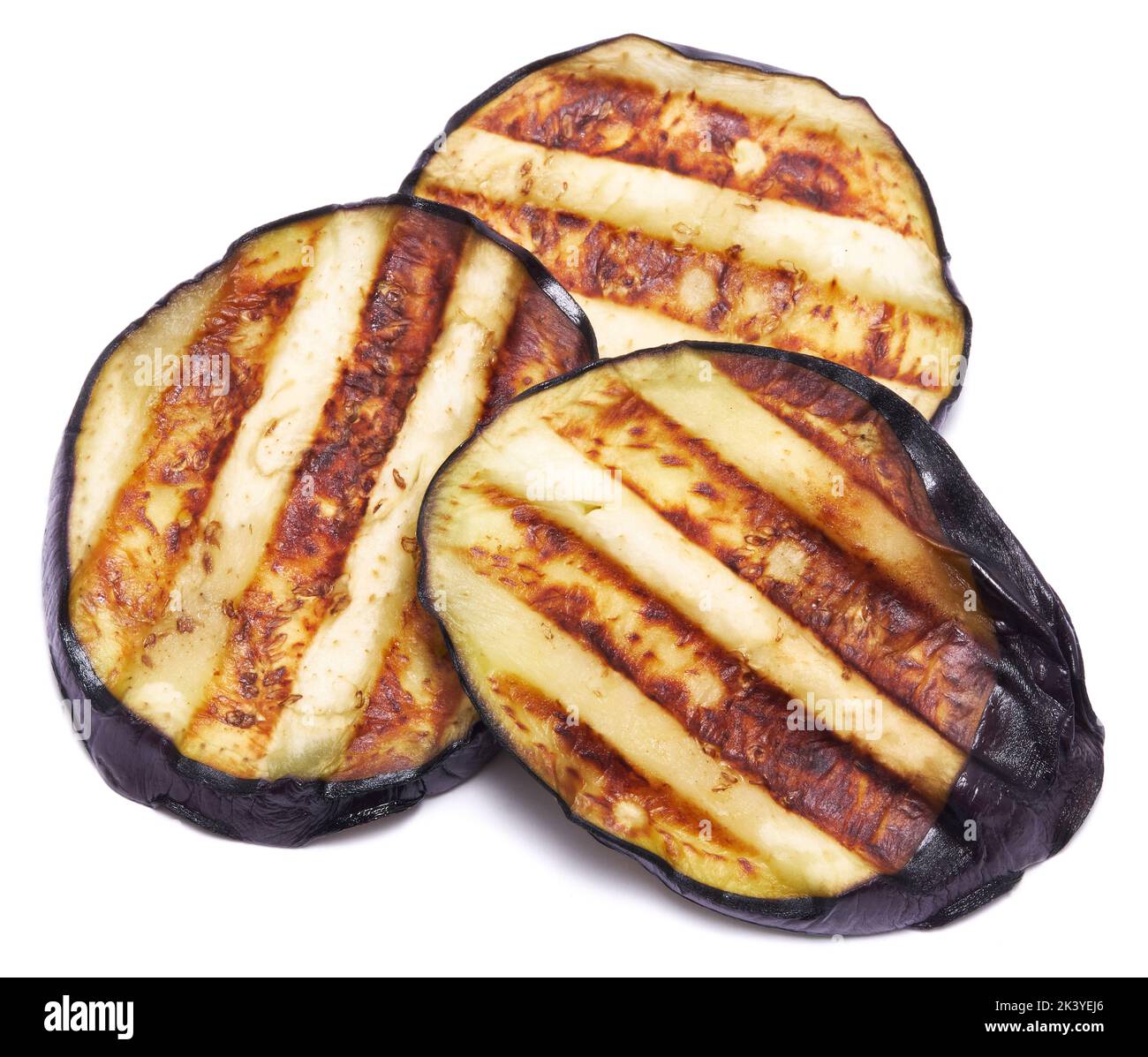 Slices of eggplant roasted on a grill with stripes from a grill
