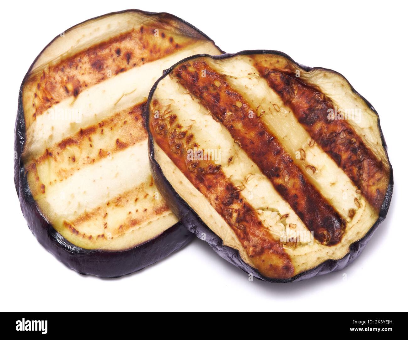 Slices of eggplant roasted on a grill with stripes from a grill