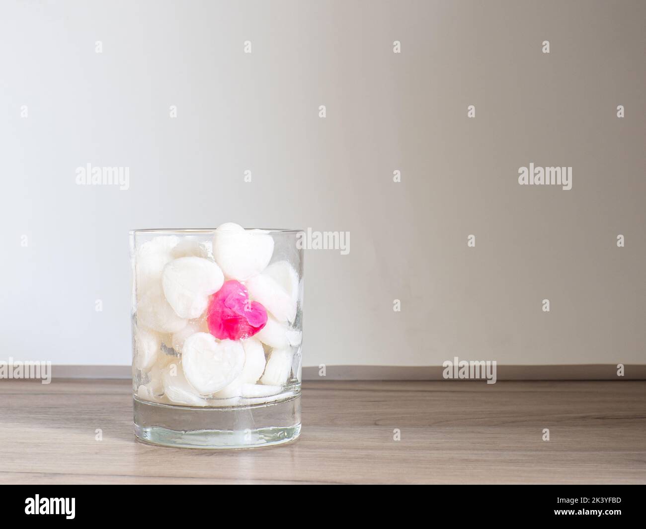 Ice cubes made from milk in heart shape in glass Stock Photo Alamy