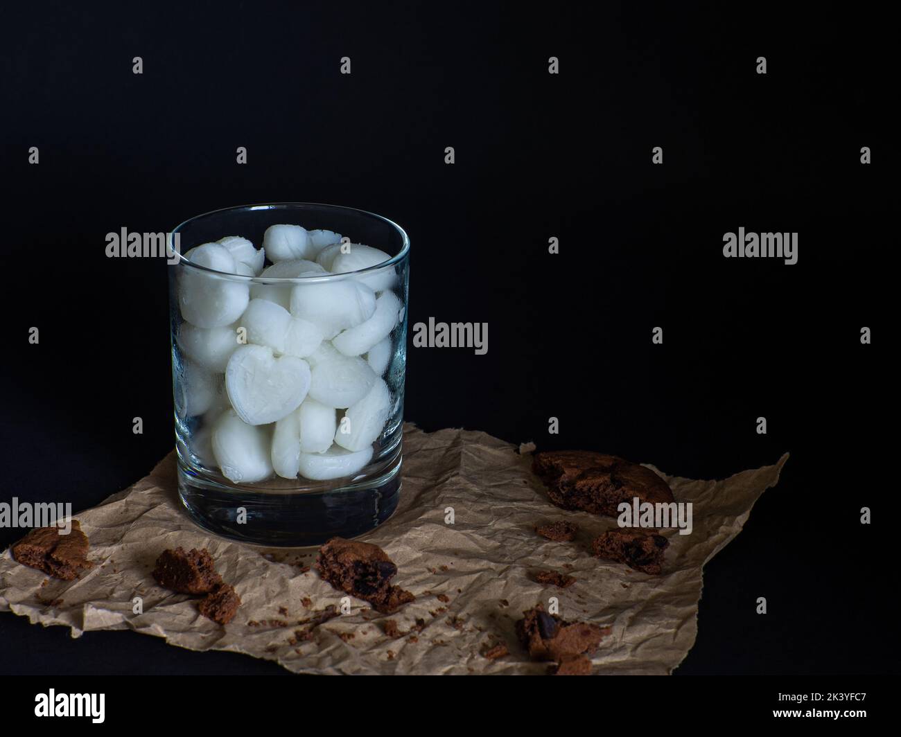 Ice cubes made from milk in heart shape in glass Stock Photo Alamy