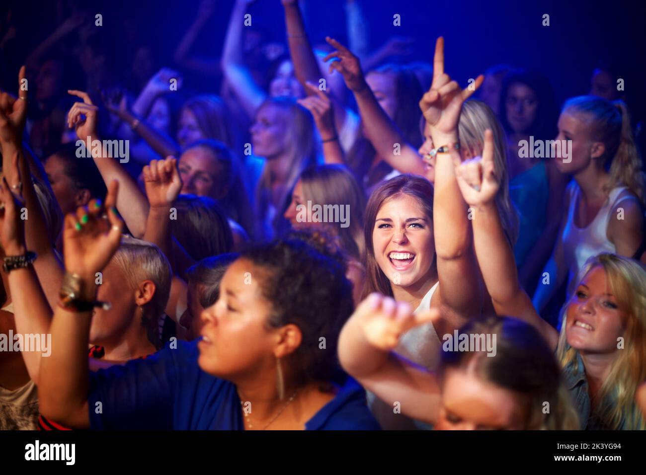 a crowd going crazy to the music at a concert. This concert was created