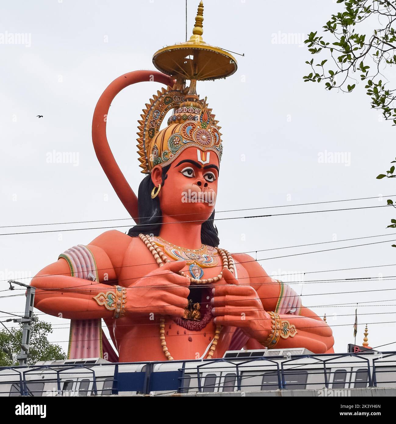 Big statue of Lord Hanuman near the delhi metro bridge situated near