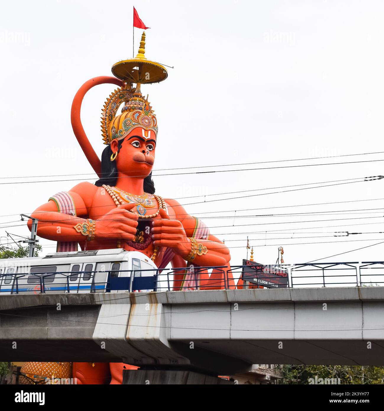 Big statue of Lord Hanuman near the delhi metro bridge situated near
