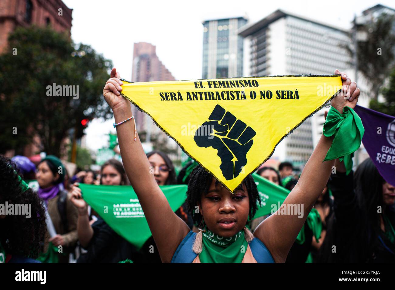 Bogota, Colombia. 28th Sep, 2022. A demonstrator holds a flag that reads 'Feminism has to anti-racist or it will not be' during the International Day for the Remembrance of the Slave Trade and its Abolition demonstrations in Bogota, Colombia, September 28, 2022. Colombia became one of the first countries in Latin America to decriminalize abortions up to week 24. Photo by: Chepa Beltran/Long Visual Press Credit: Long Visual Press/Alamy Live News Stock Photo