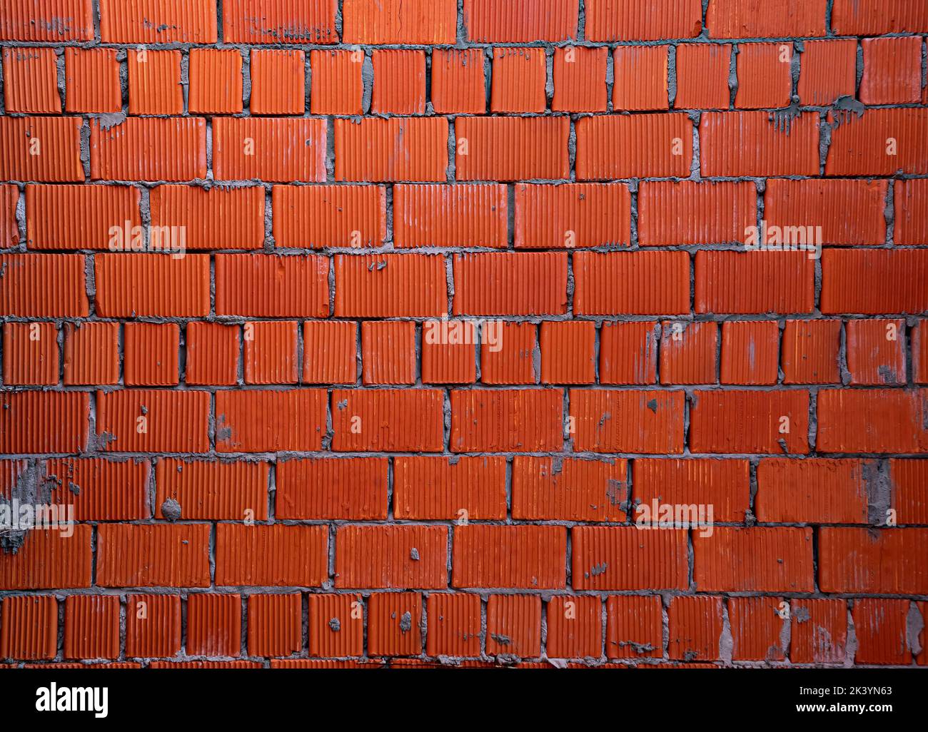 Brick wall of rough masonry. Large bricks in close-up. Walls in roughing. Brick wall texture Stock Photo