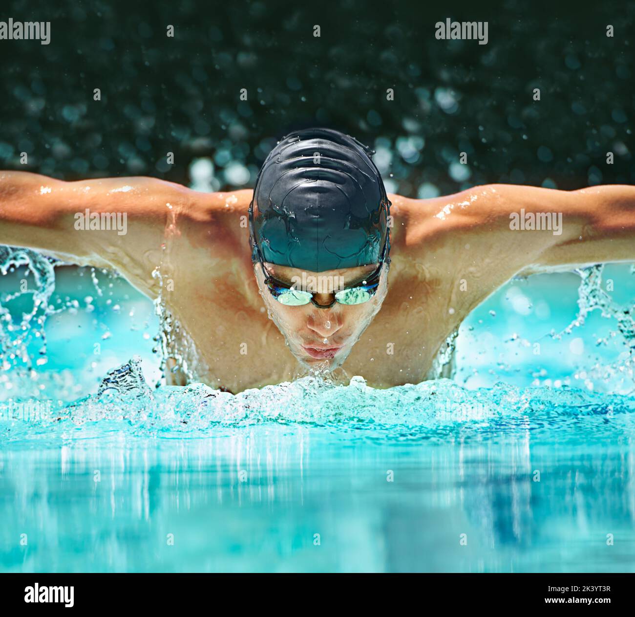 Perfect butterfly stroke. a male swimmer doing the butterfly stroke
