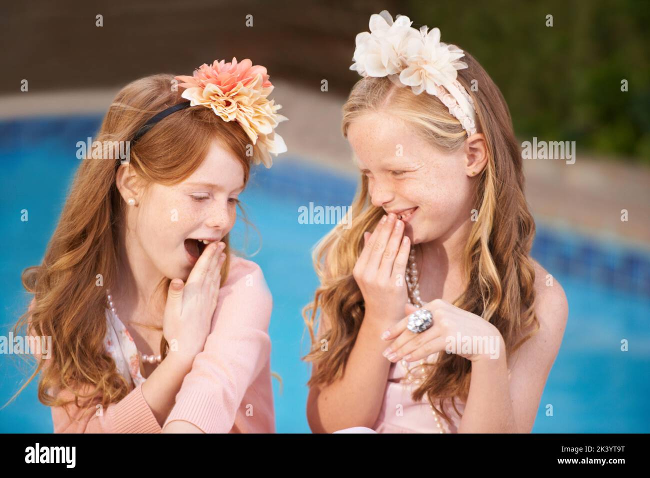 Having fun with her friend. Two little girls dressed up in fancy clothes. Stock Photo