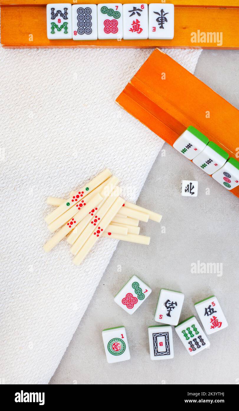 Classic mahjong board game tiles and play, ancient Chinese favorite Stock Photo