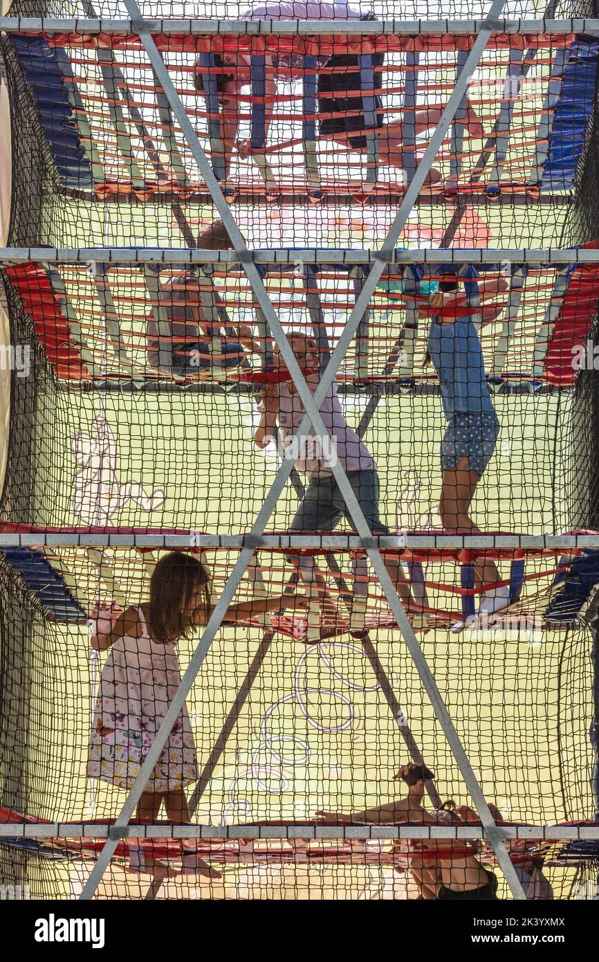 Children playing in a climbing game Stock Photo Alamy