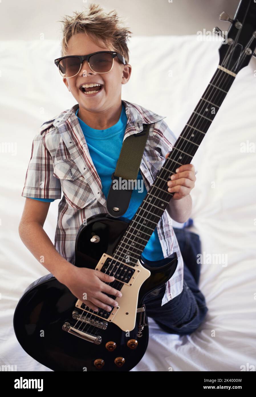 Youre never too young to learn a Slayer riff. A little boy playing an