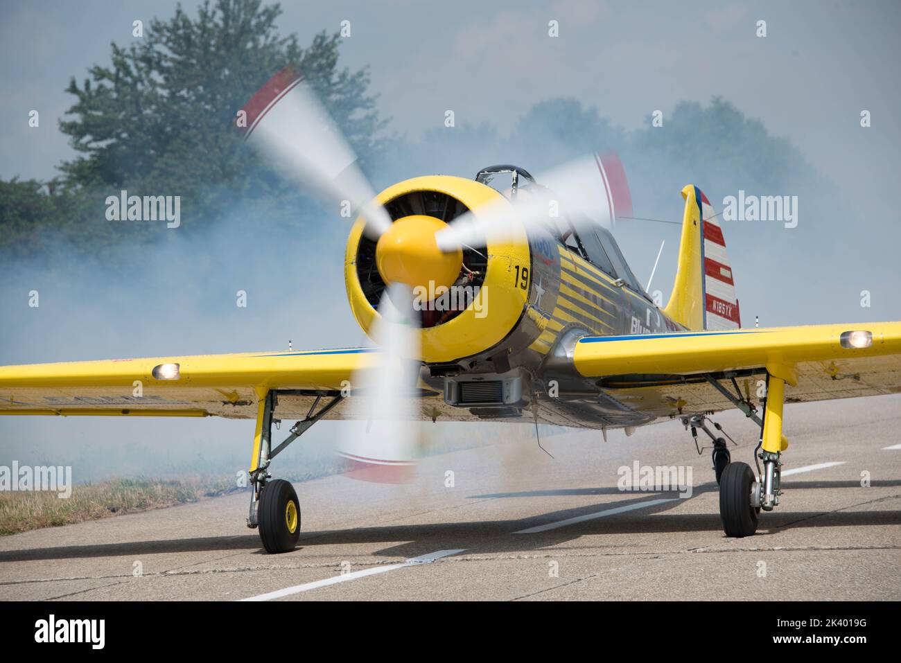 Yellow propeller plane equipped and ready to take off Stock Photo Alamy