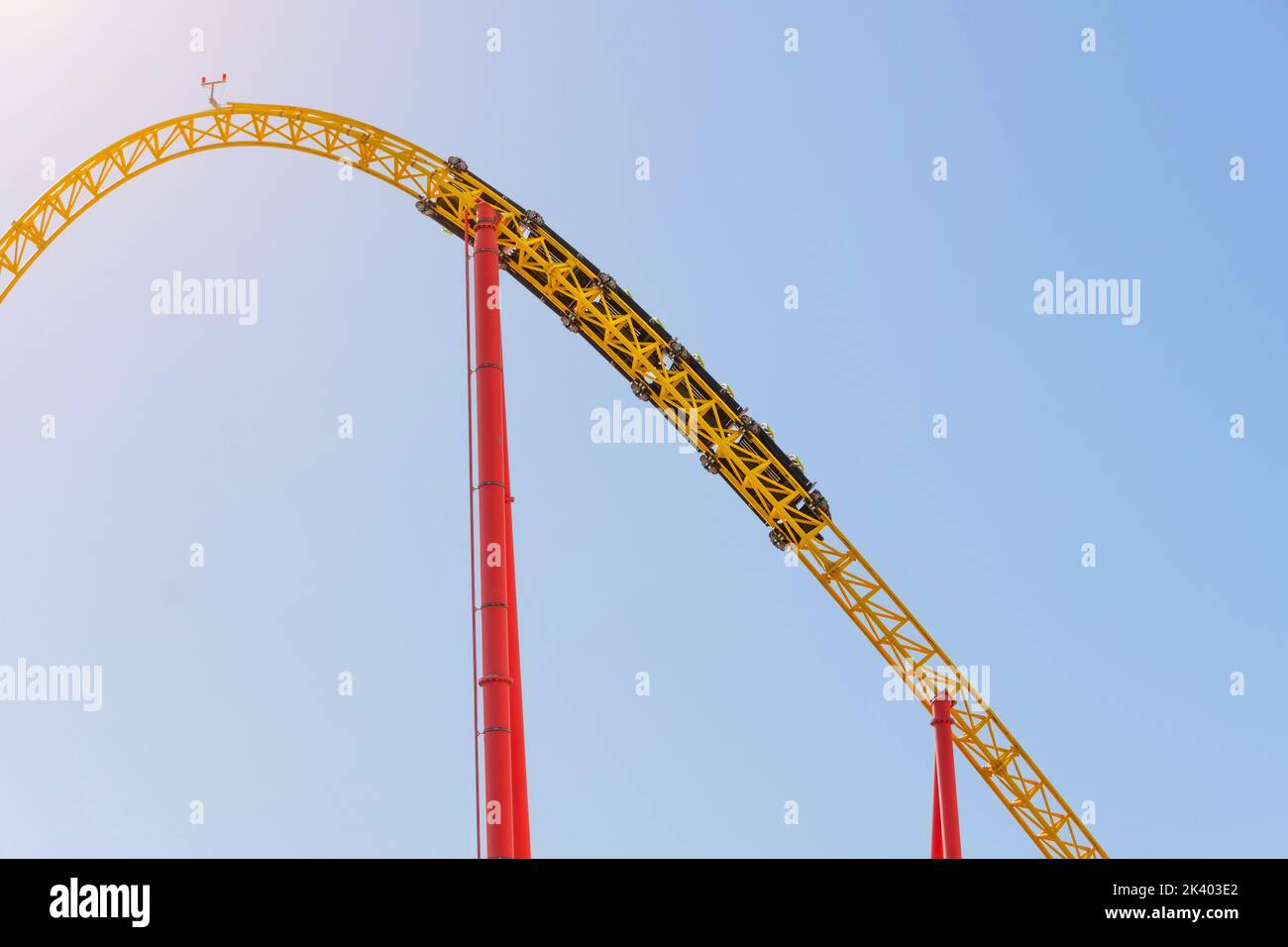 Amusement trolley makes circle loop turns upside down, roller coaster Stock Photo