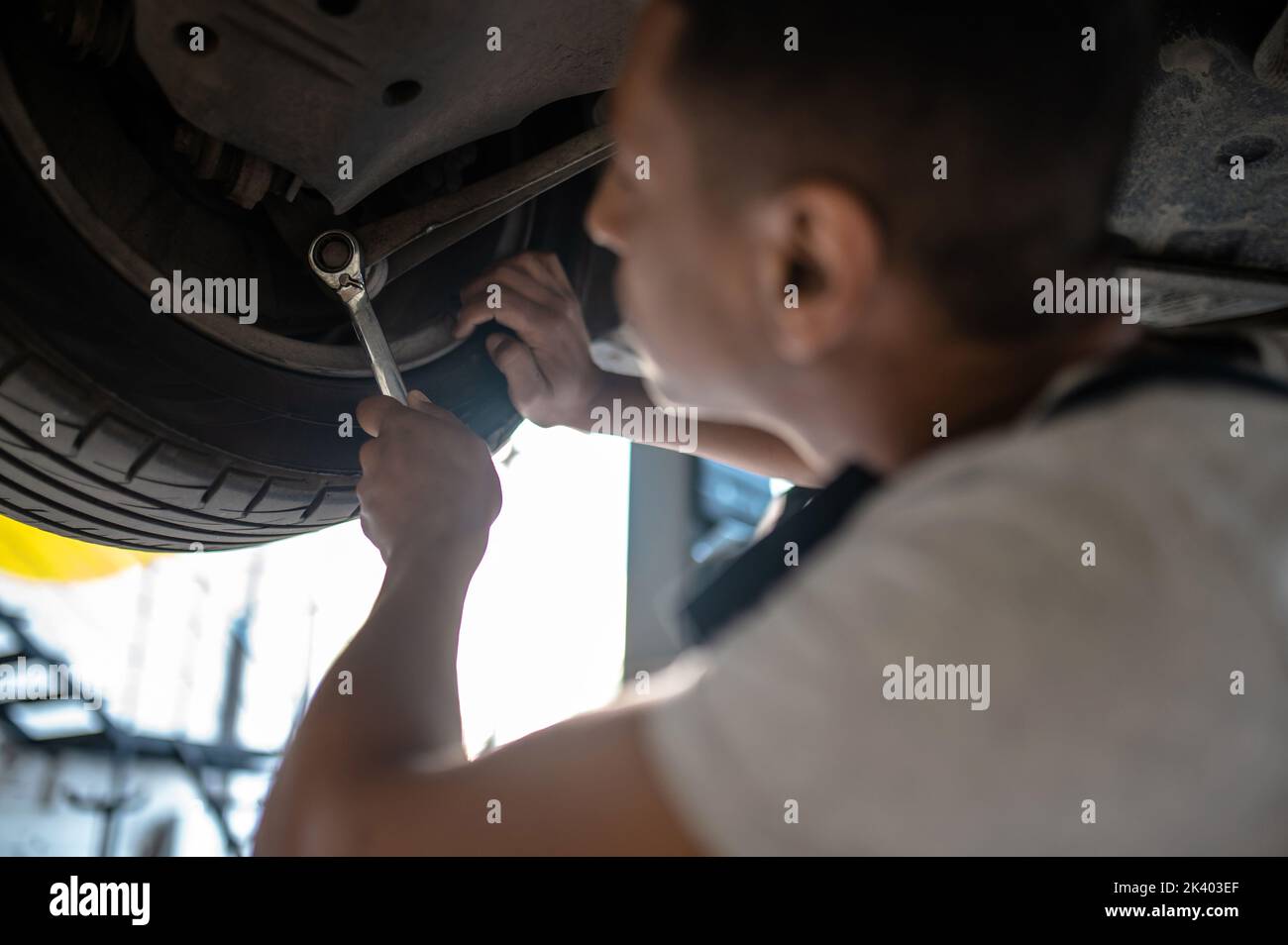 Experienced auto repair worker fixing the customer automobile Stock Photo