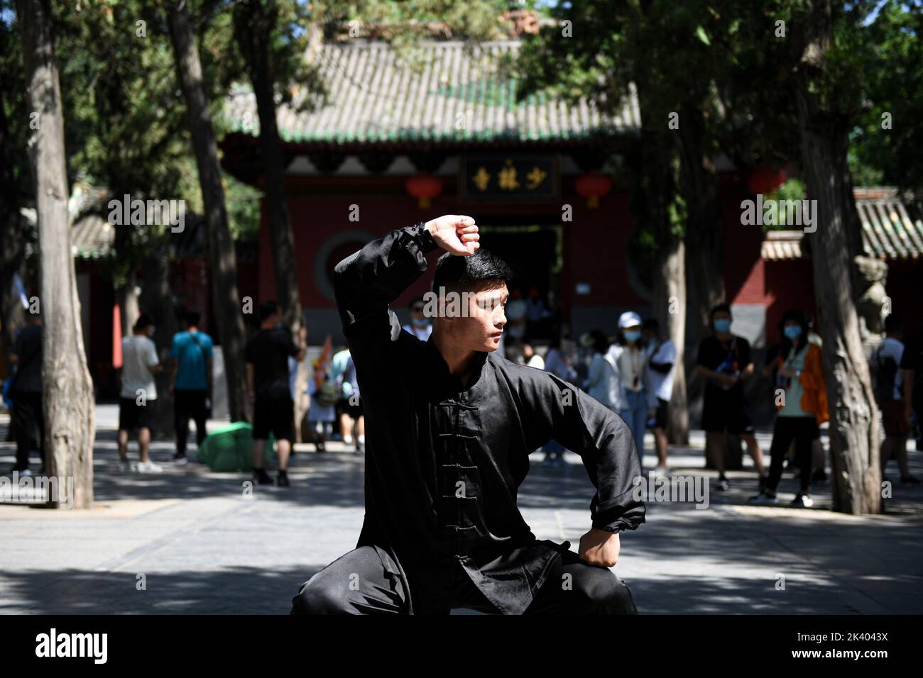 (220929) -- ZHENGZHOU, Sept. 29, 2022 (Xinhua) -- Li Yinggang practices martial arts at Shaolin Temple in Songshan, central China's Henan province, July 7, 2022. 25-year-old Li Yinggang is a coach at Shaolin Tagou Martial Arts School in Songshan, central China's Henan province. He started martial arts practise at the age of 9 and shifted to free combat 3 years later. Since he was 16 years old, Li has been taking part in the professional free combat competitions, ever winning the titles of domestic and international events several times including two golden belts of Chinese National Free Comba Stock Photo