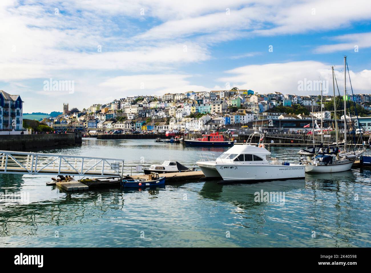 Charter boat by a jetty in the harbour. Brixham, Devon, England, UK, Britain Stock Photo