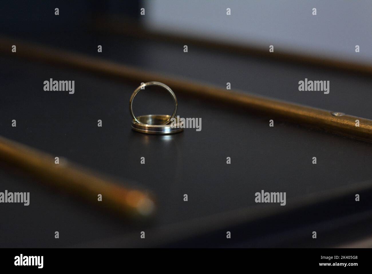 Beautiful wedding rings on the table Stock Photo - Alamy