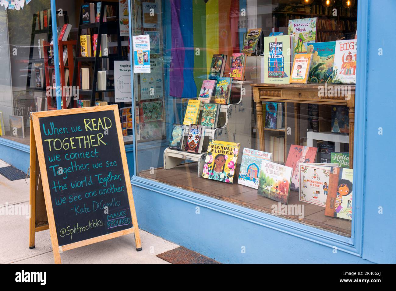 A chalk & blackboard sign outside Split Rock Books quoting, Kate DiCamillo, a children's fiction author. In Cold Spring, New York. Stock Photo