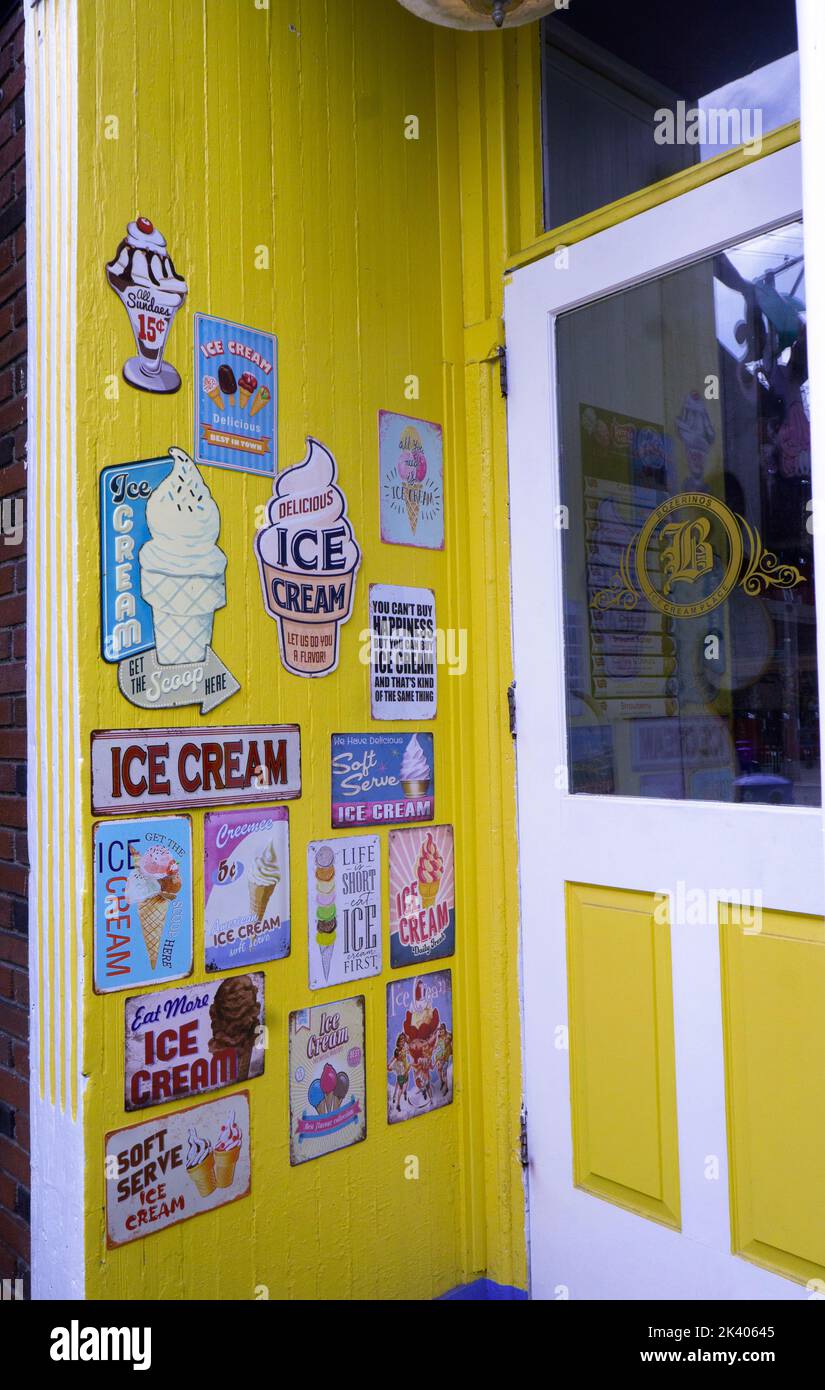 The entrance to Bozerinos Ice Cream Place on Main St. in Cold Spring New York. It's decorated with vintage art signs. Stock Photo