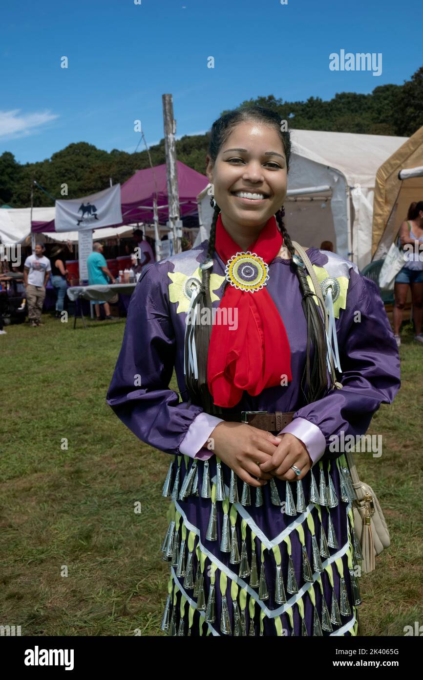 Posed portrait of a Shinnecock Native American in a traditional Jingle dress. At their annual powwow in Southampton, Long Island, New York. Stock Photo