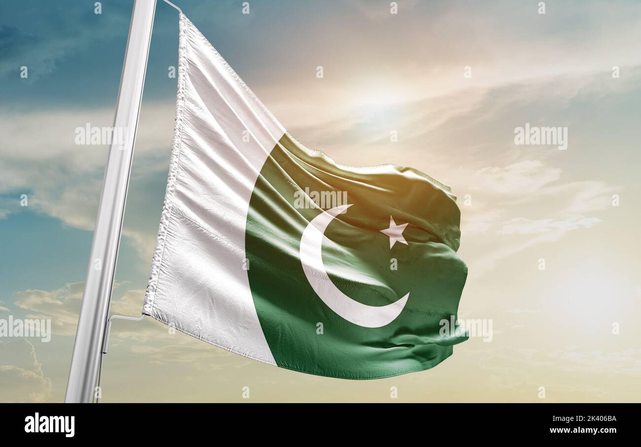 Pakistan national flag waving in beautiful sky. Stock Photo