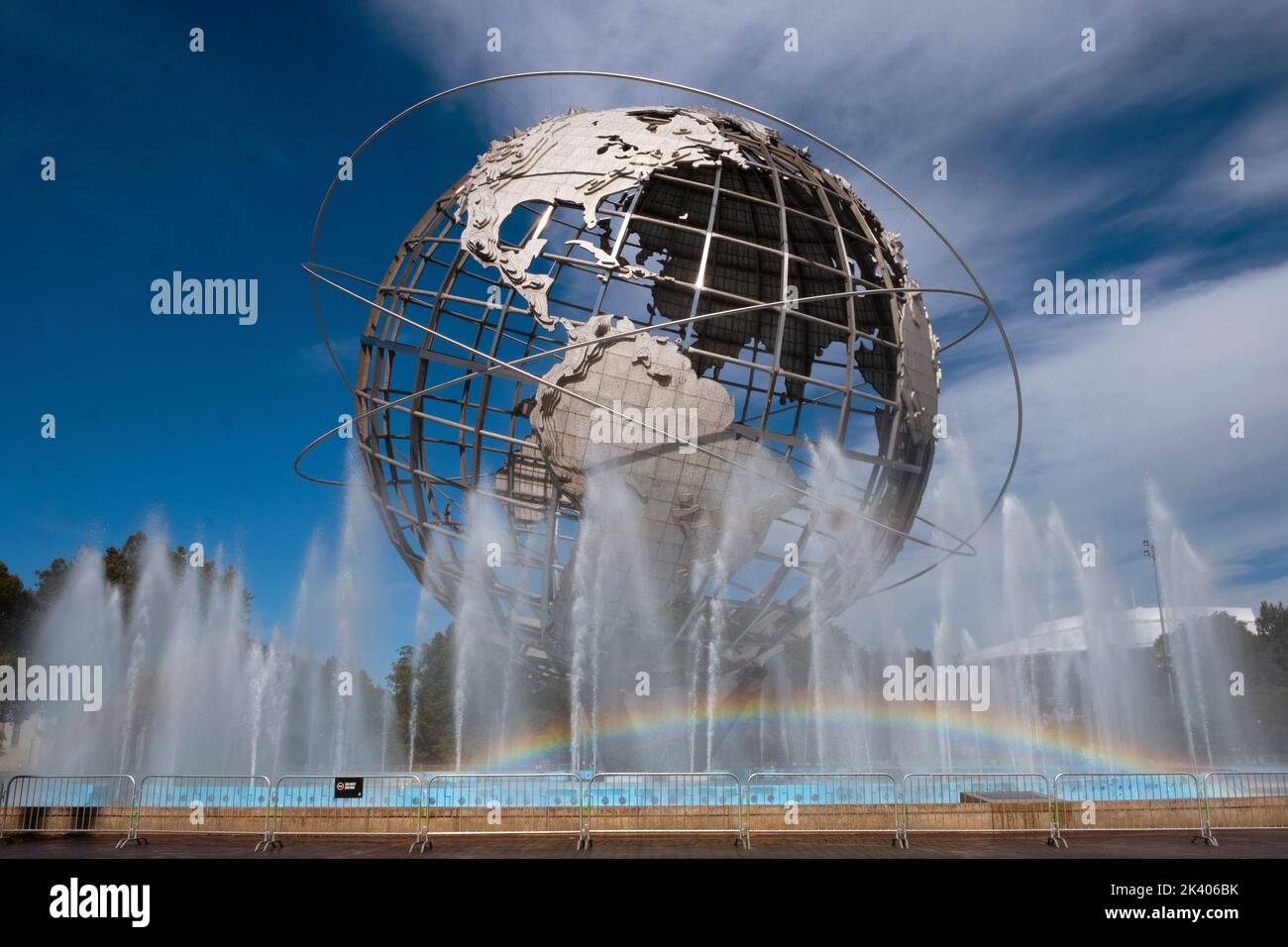 A visible rainbow seen in the fountains surrounding the Unisphere in Flushing Meadows Corona Park in Queens, New York City. Stock Photo