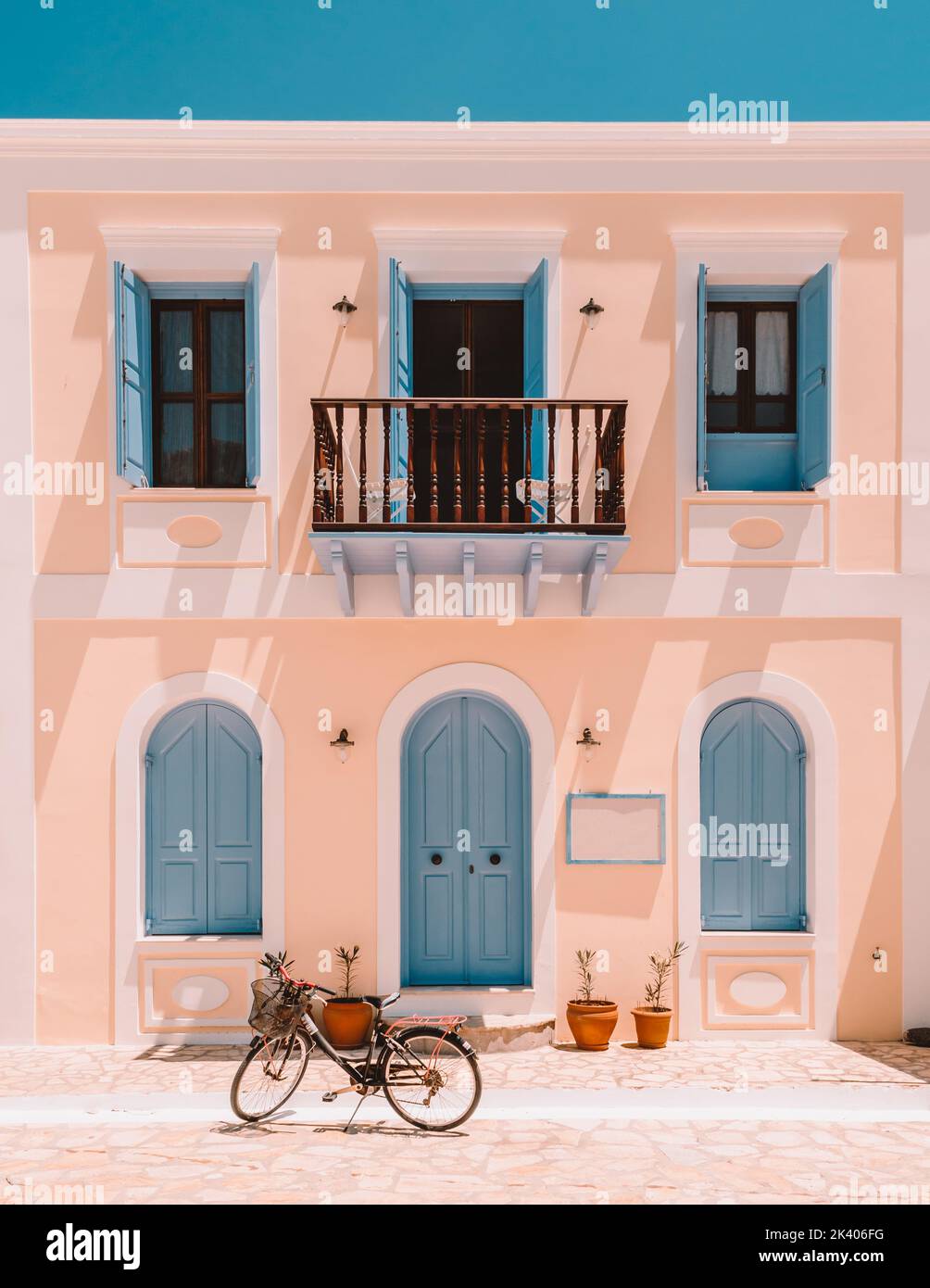 Old Greek house with blue windows and door and red retro scooter Stock ...
