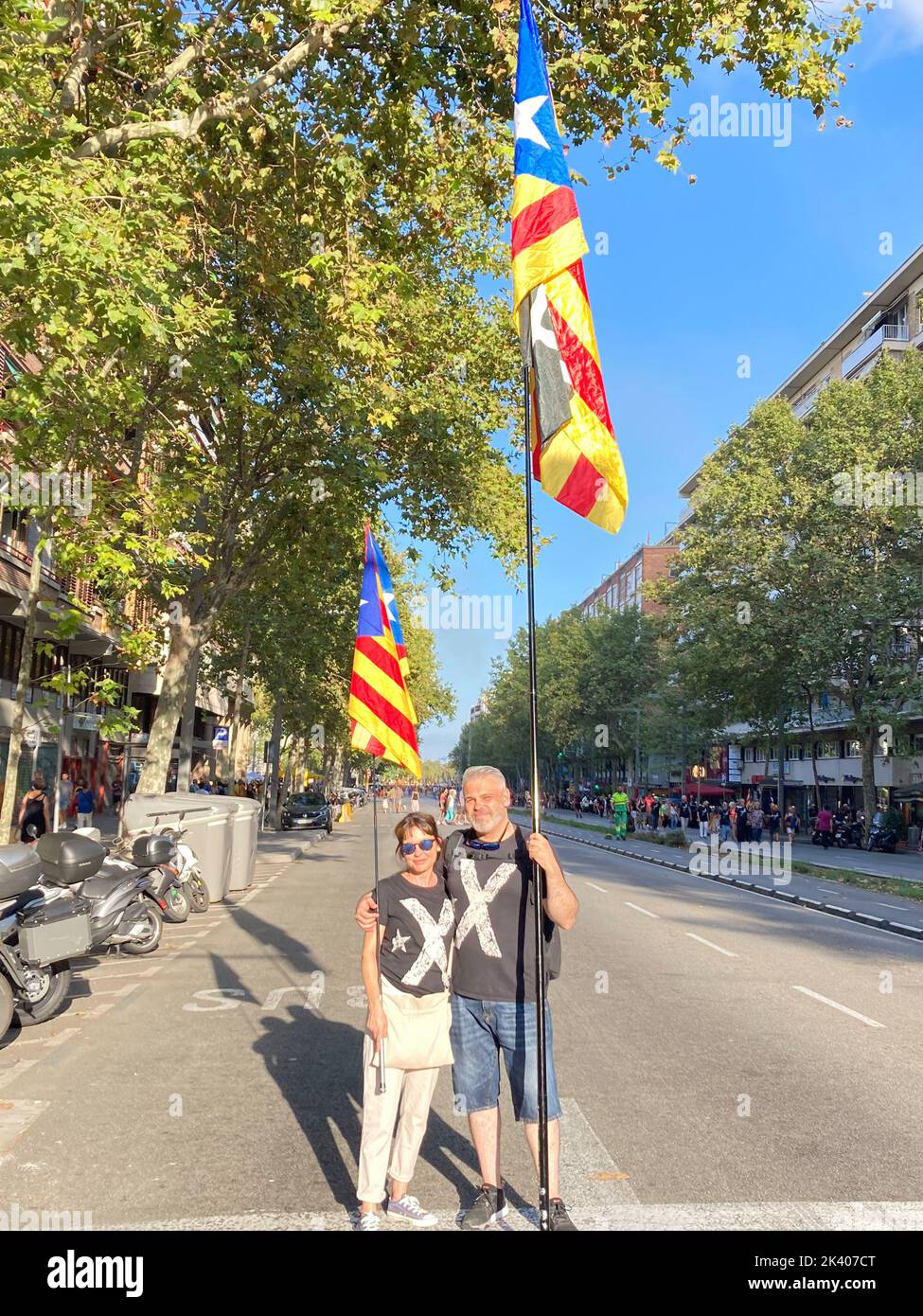 Barcelona, Spain. 11th Sep, 2022. Jordi and Eva stand by a Catalan flag. Five years after the Catalan independence referendum, the euphoria has now faded. The separatists are divided. (to dpa 'Much frustration five years after Catalonia's chaos referendum') Credit: Emilio Rappold/dpa/Alamy Live News Stock Photo