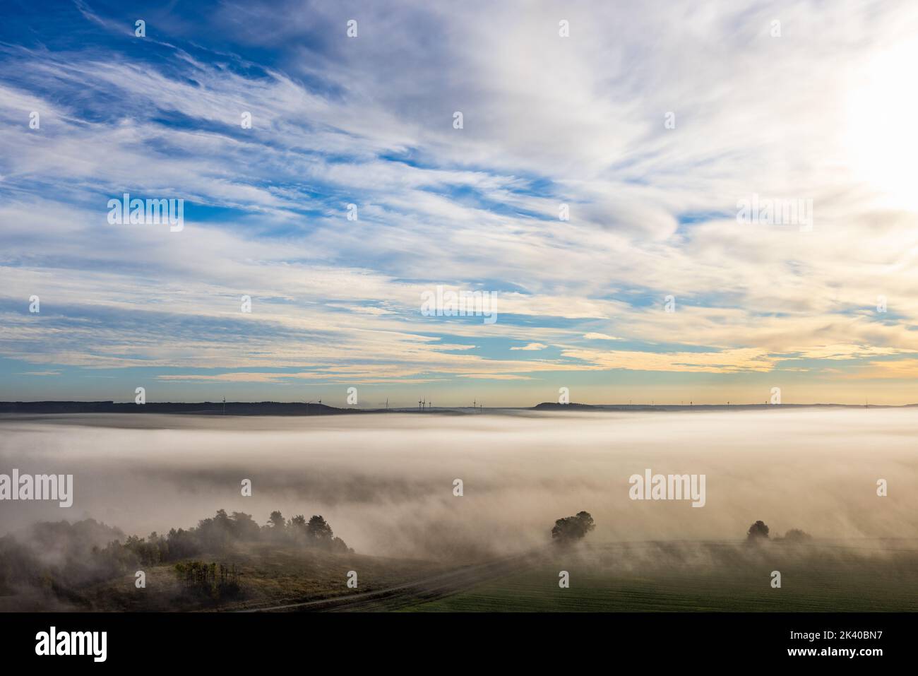 Sunrise with fog over the landscape Stock Photo - Alamy