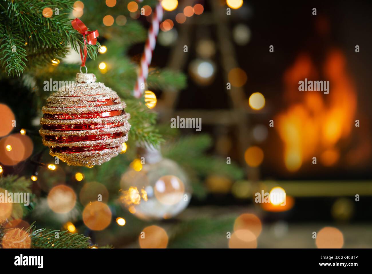 Festive bright Christmas ornaments on fireplace background. Stock Photo