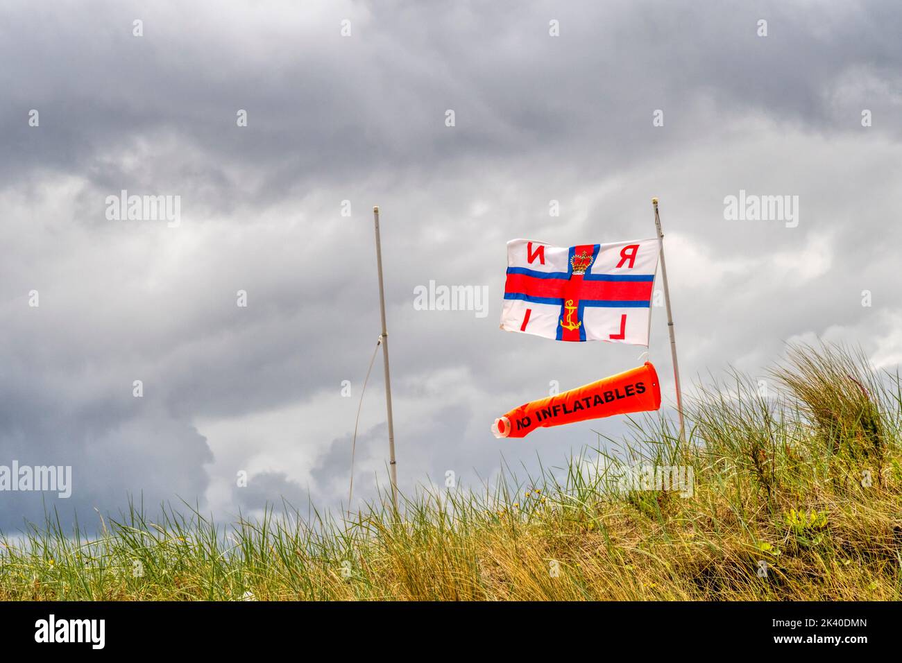 RNLI No Inflatables flag flying at beach. Stock Photo