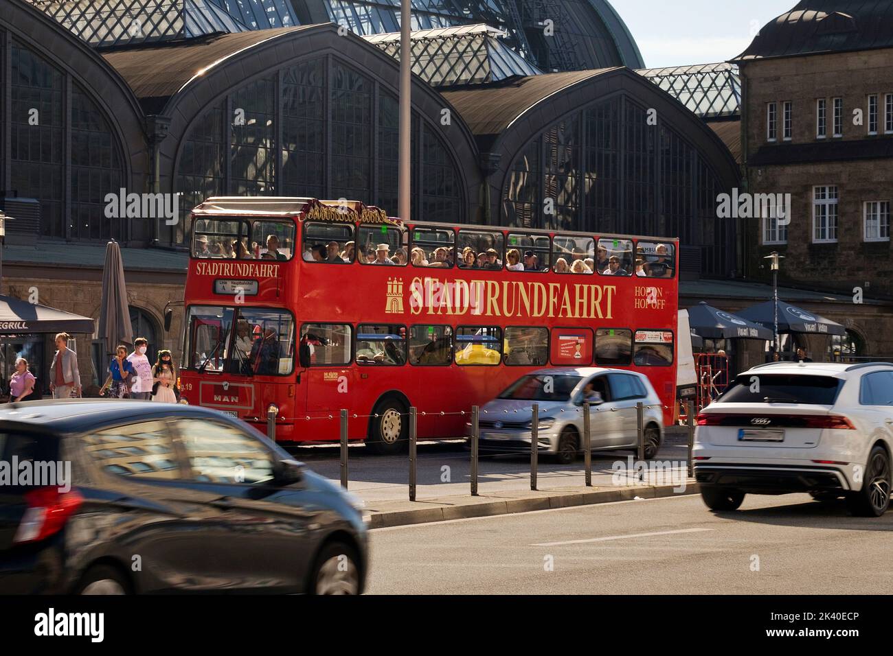 red double-decker bus in front of the main train station, city tour, Germany, Hamburg Stock Photo