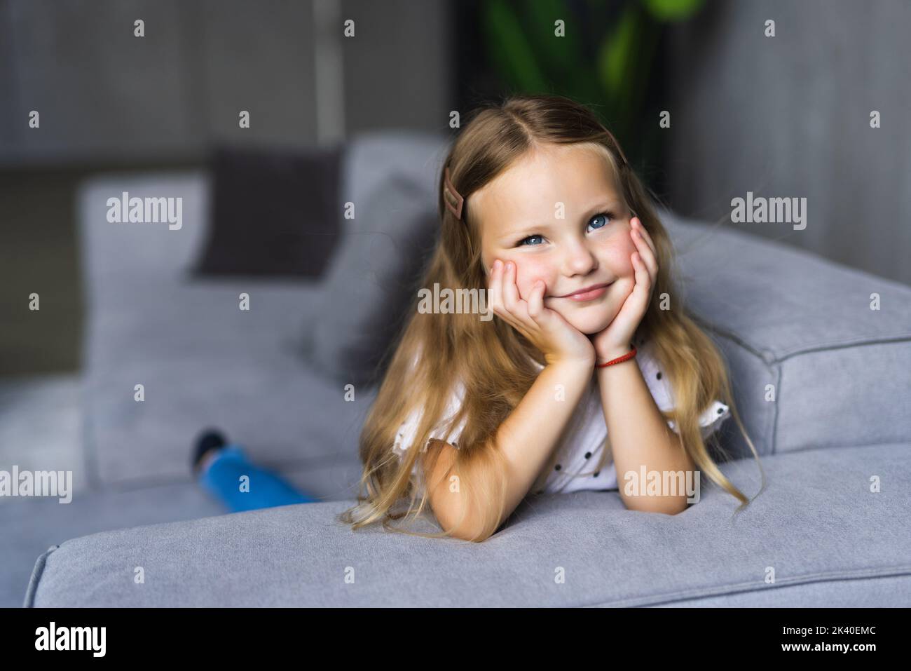 Little girl having fun at home. Happy smile on the childs face. Little