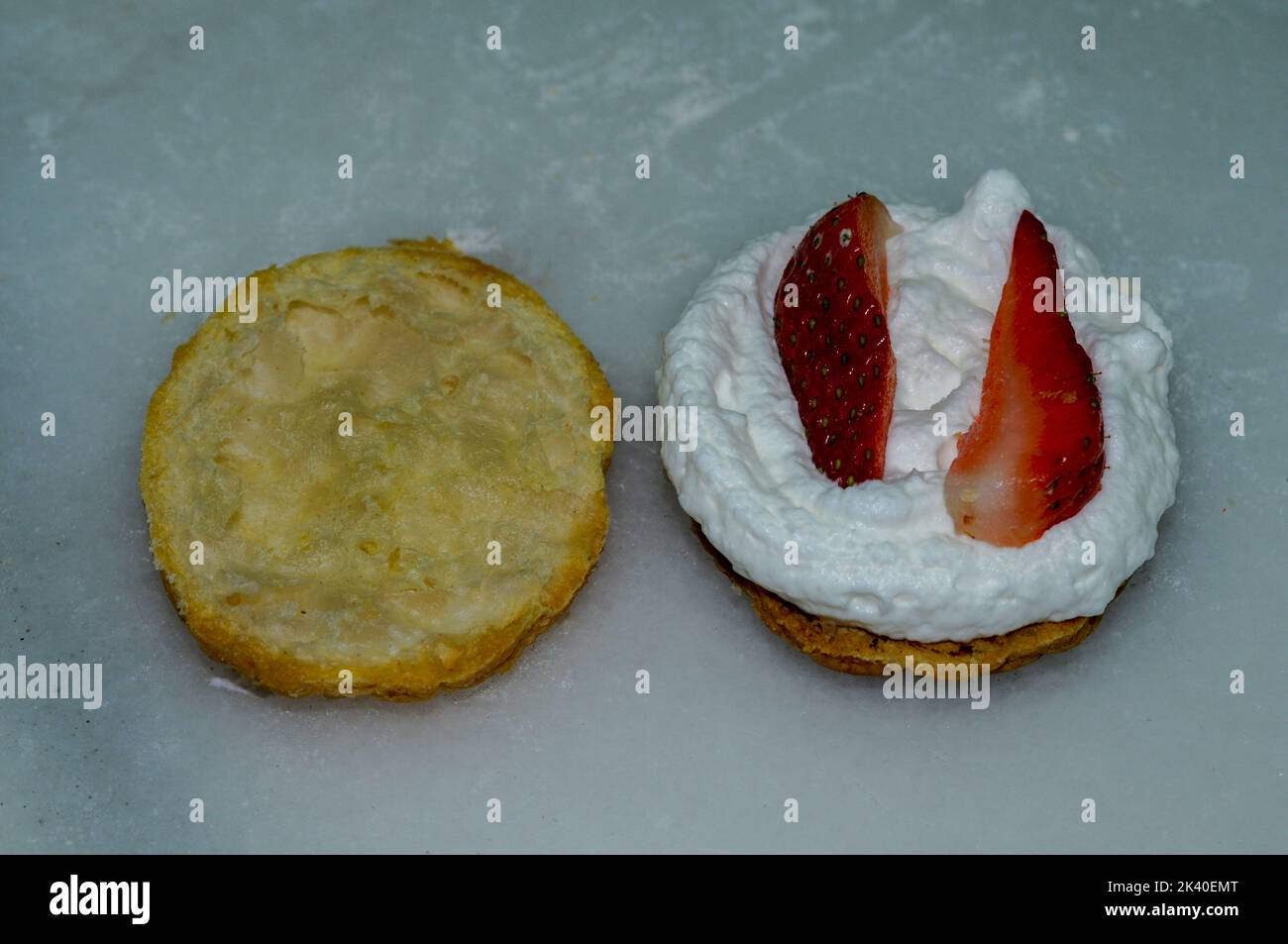 Cream and strawberry cupcakes, made in a pastry kitchen Stock Photo