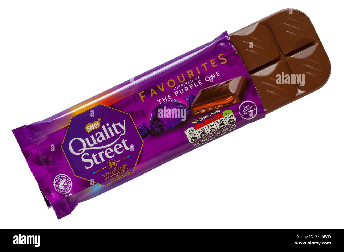 Bar of Quality Street Favourites inspired by the Purple One chocolate bar of chocolate from Nestle opened to show content isolated on white background Stock Photo